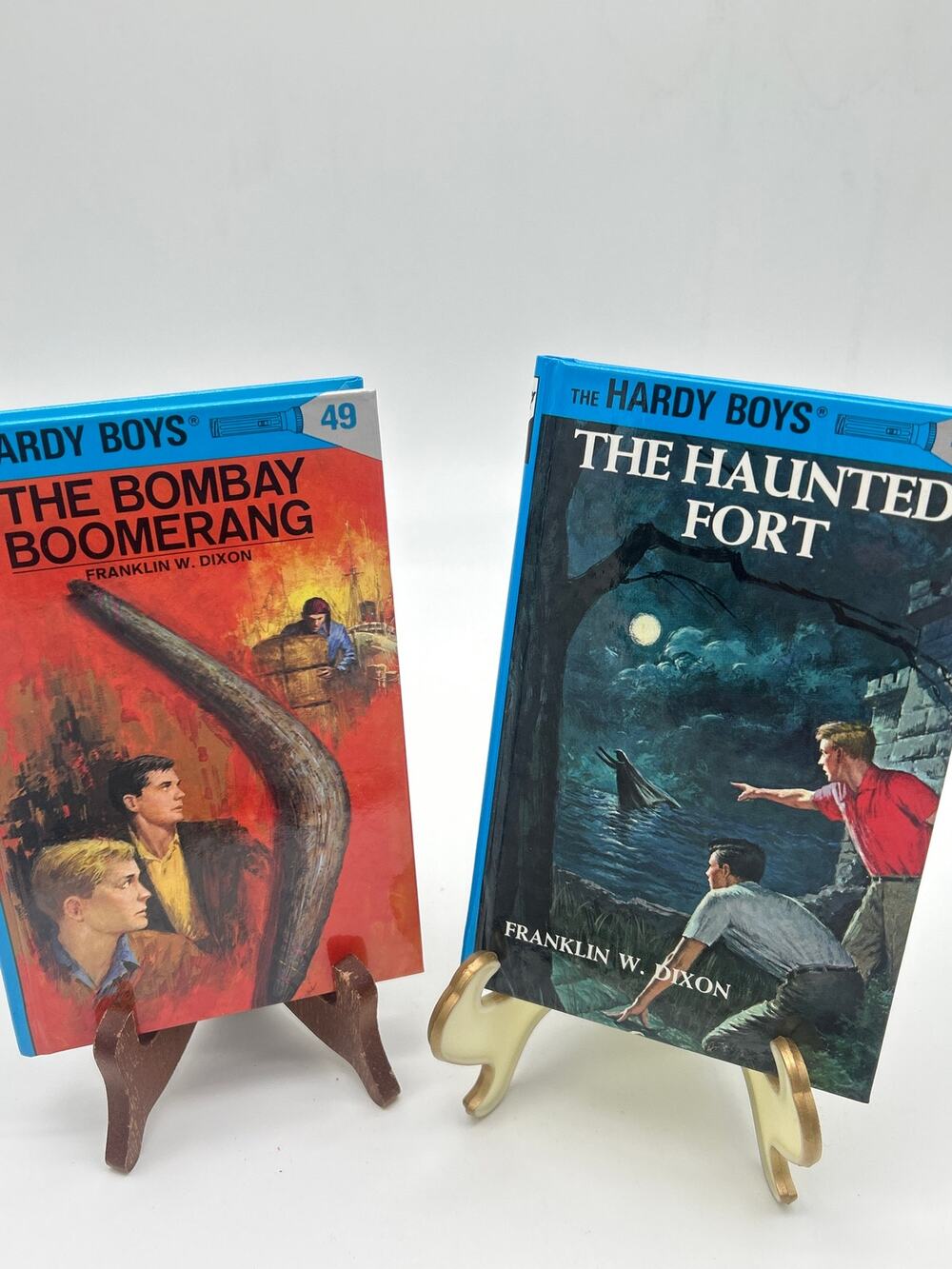 Lot of 2 Hardy Boys Hardcover Books Haunted Fort Bombay Boomerang 1998 2003